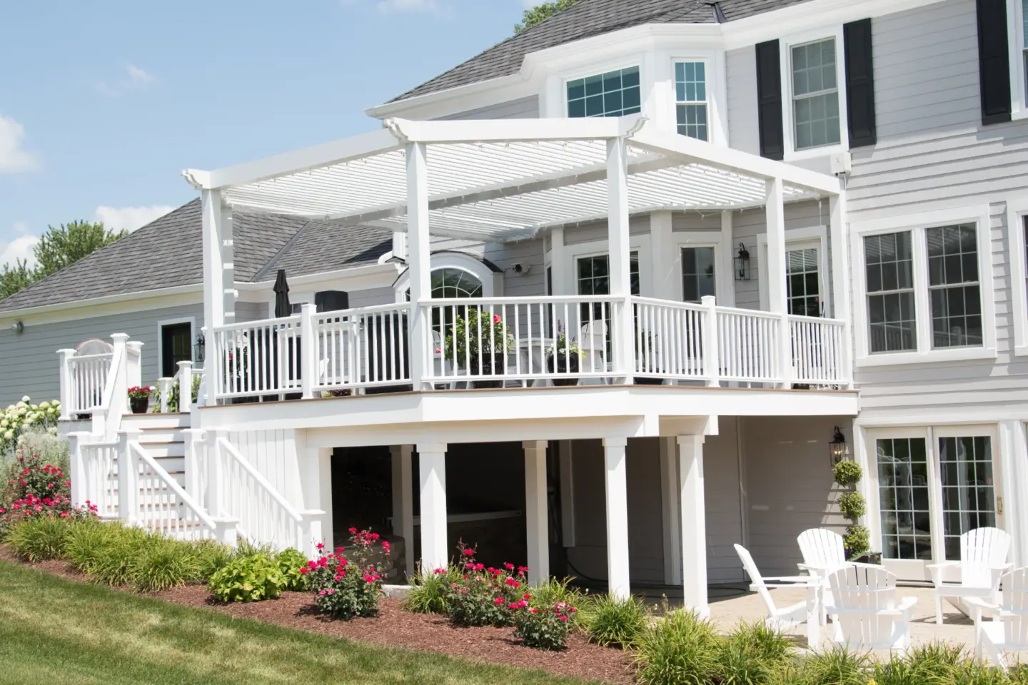 01 TimberTech Vintage English Walnut deck with white TimberTech Premier railing and Arcadia louvered pergola