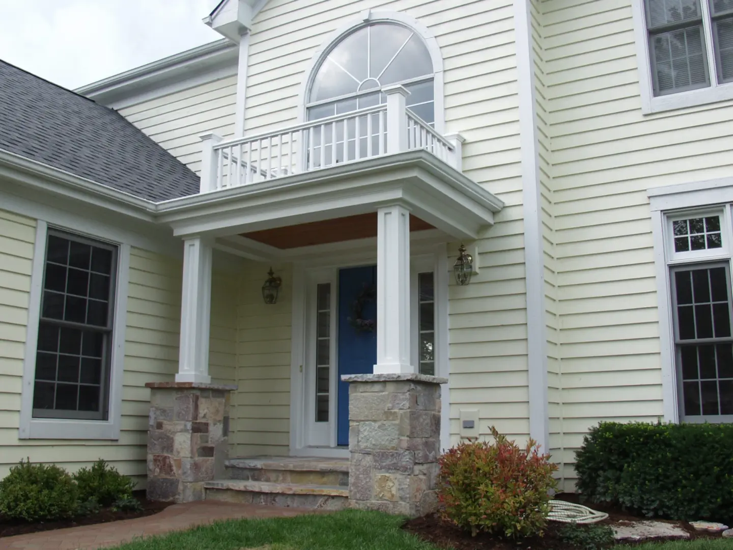 08 white portico entrance with decorative balcony