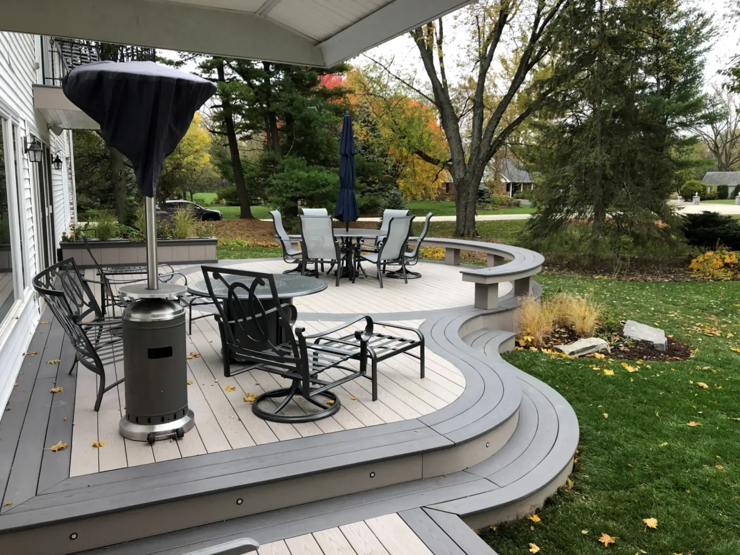 14 TimberTech Slate Gray and Castle Gate cellular pvc deck with patio table and curved boards stairs and bench