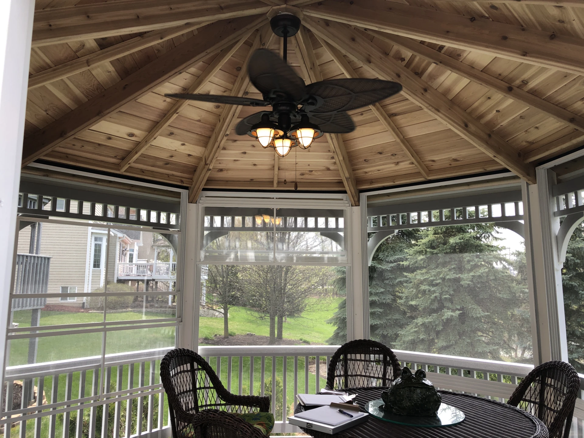 14 inside of a white pvc gazebo with 4 track windows and a knotty cedar ceiling