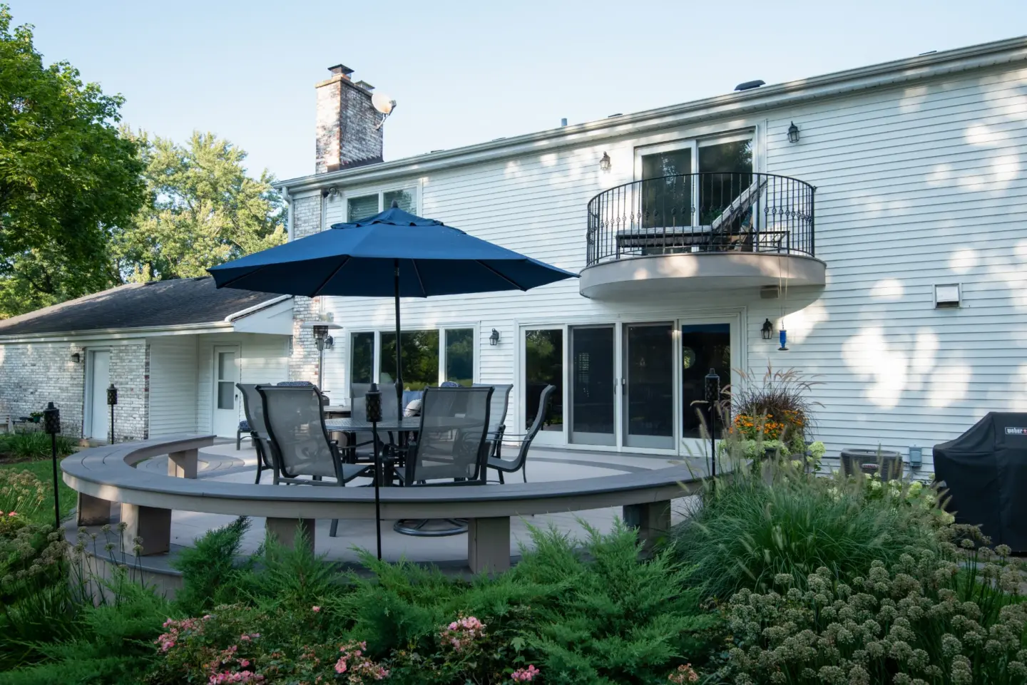 16 TimberTech Slate Gray and Castle Gate cellular pvc deck with patio table and curved boards stairs and bench