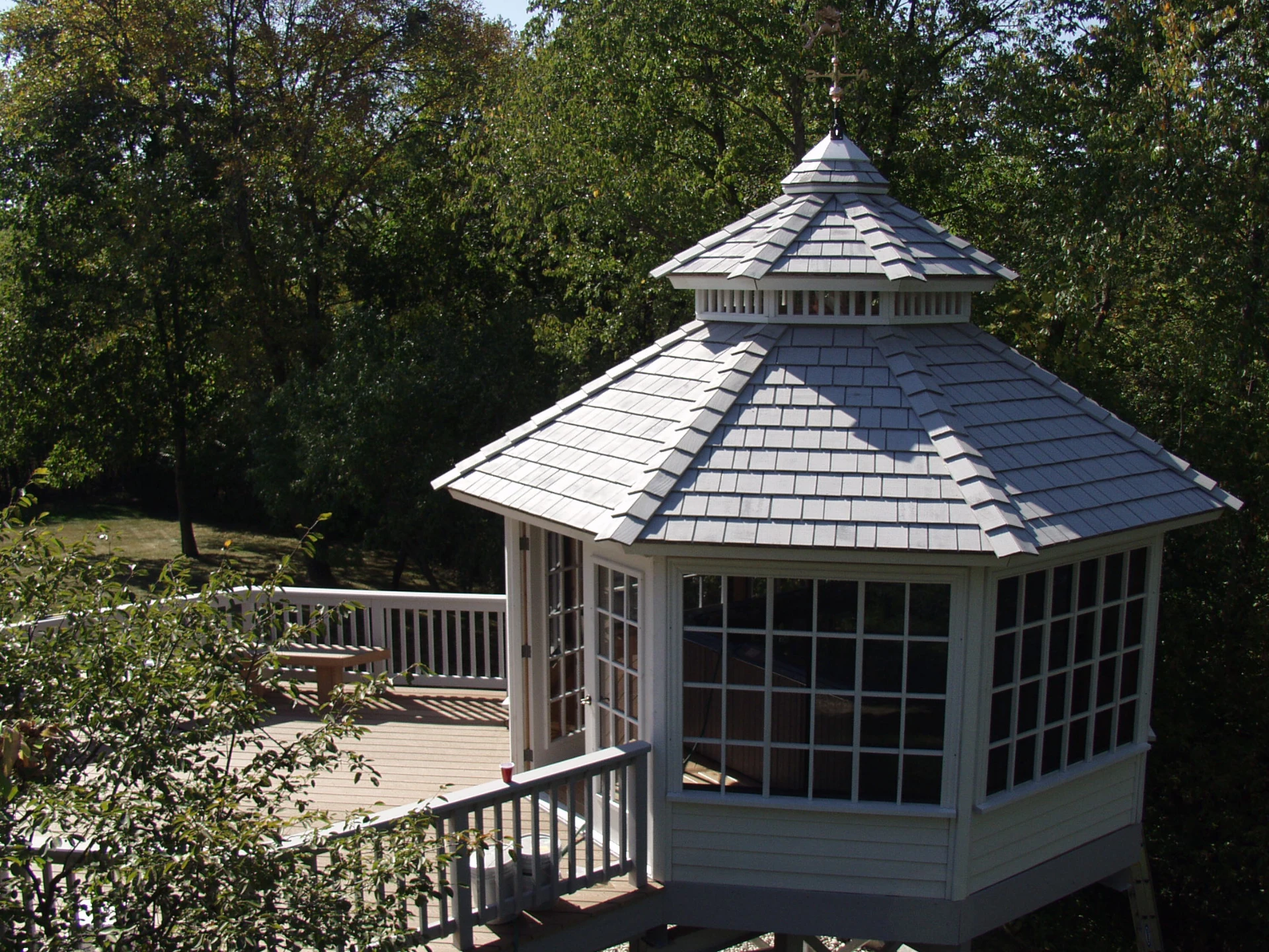 24 large white pagoda gazebo with gray roof attached to brown pvc deck