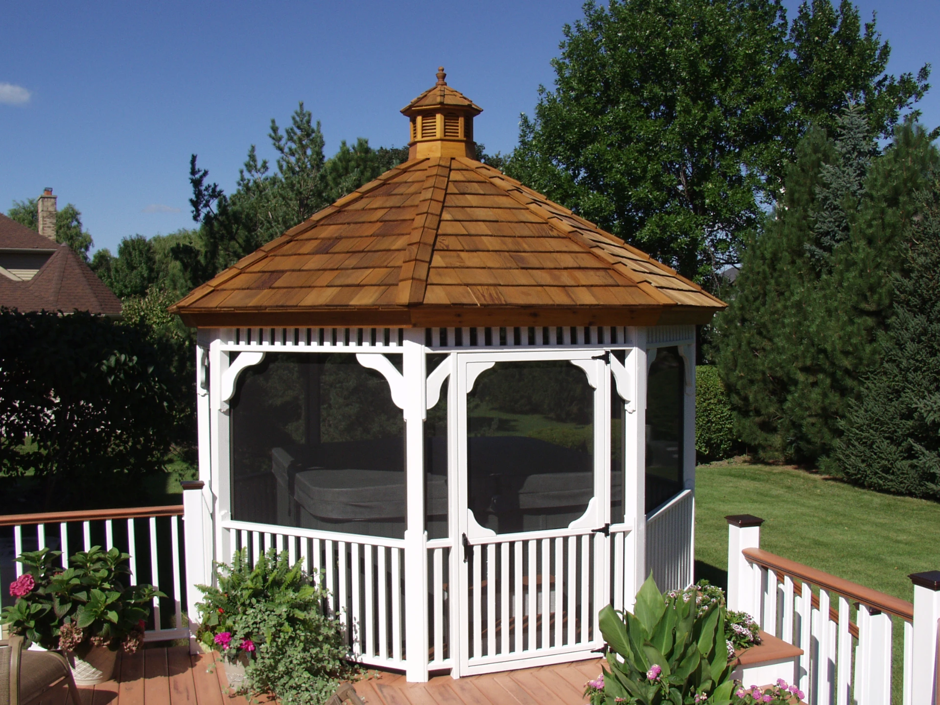 25 white pvc gazebo with stained cedar shakes and screen windows