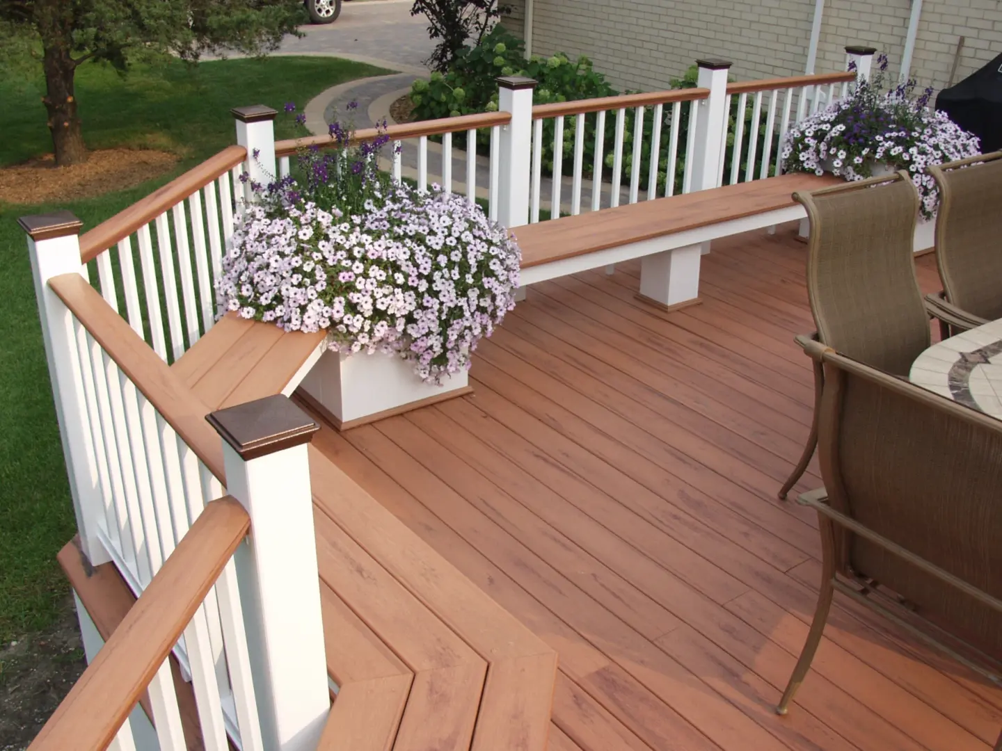 32 reddish brown composite deck with benches and flowers